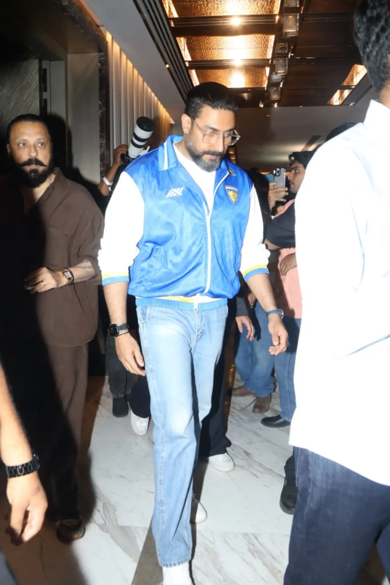 Abhishek Bachchan was also seen arriving for the grand launch of the Indian Super Gaming League (ISGL) in a blue varsity jacket and jeans.